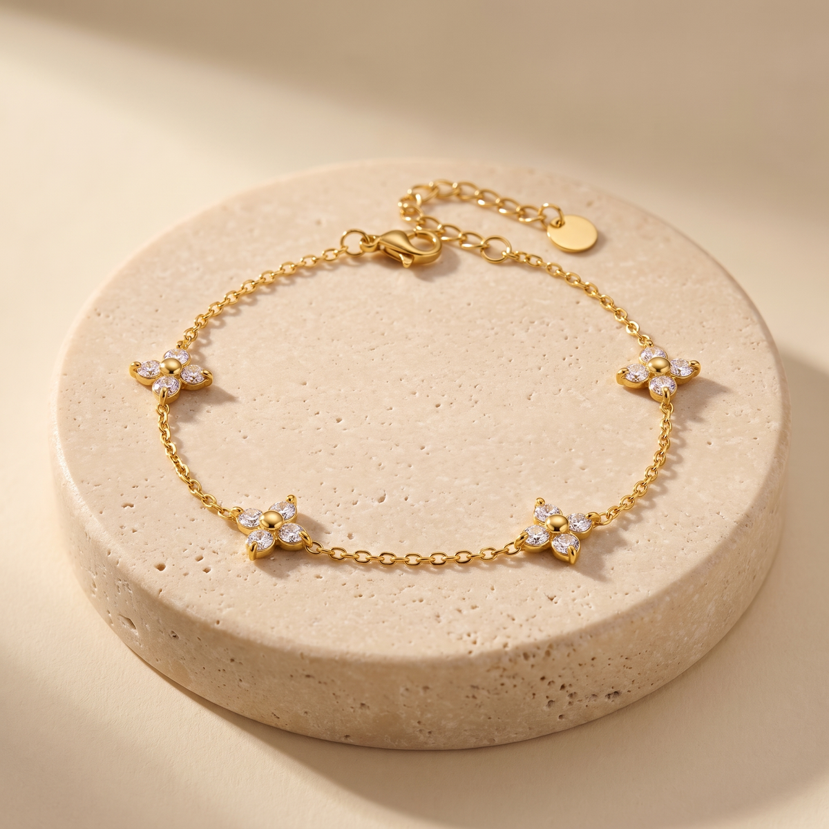 Alba Clover Station Bracelet displayed on travertine